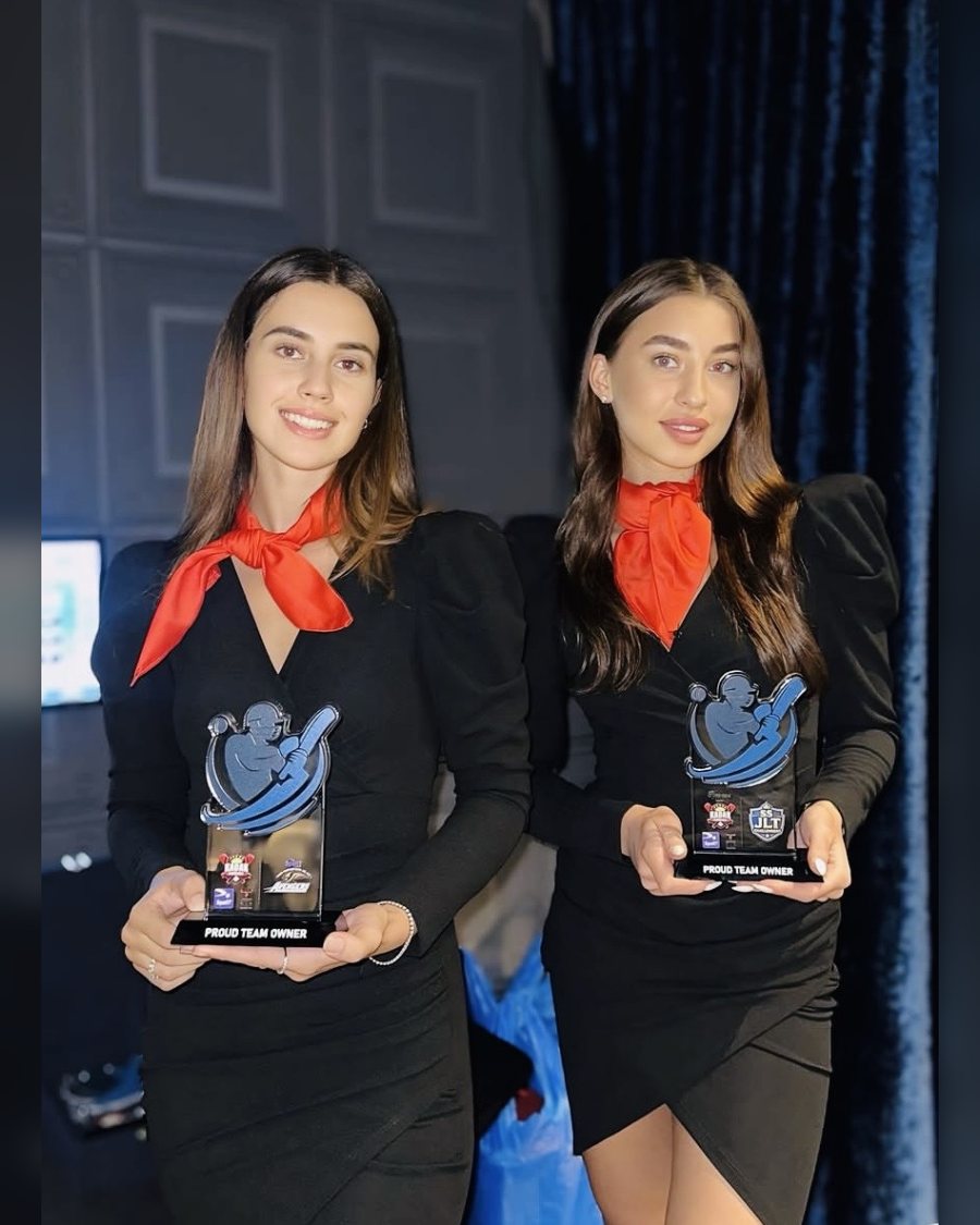 Award presentation hostesses holding trophies