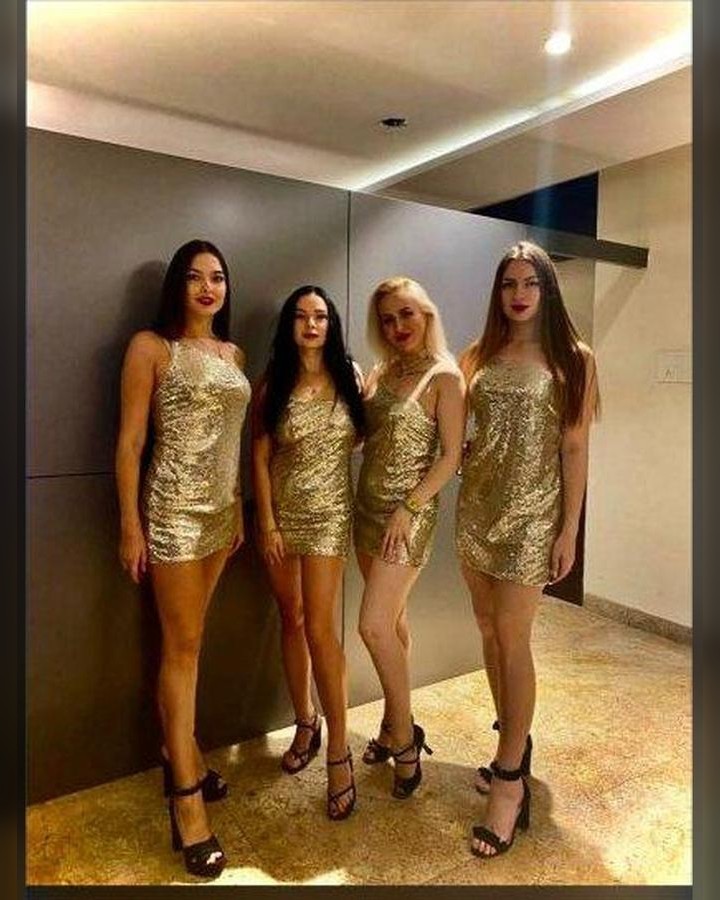 International hostesses in gold uniforms