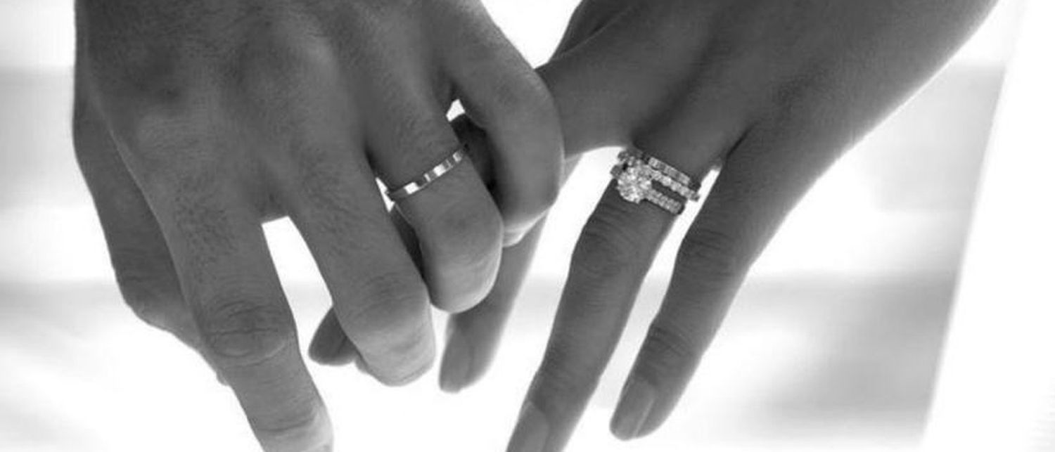 Bride and groom exchanging rings