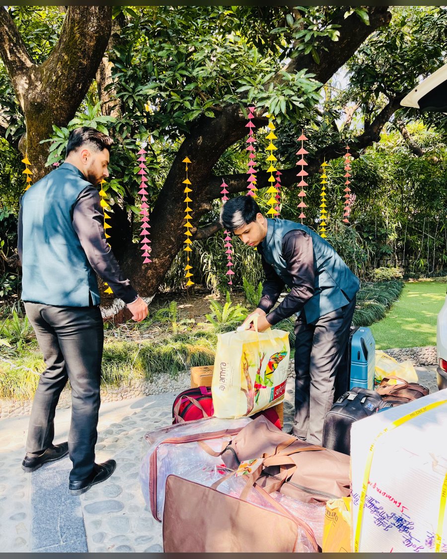 Porters moving guest baggage to rooms at a wedding venue