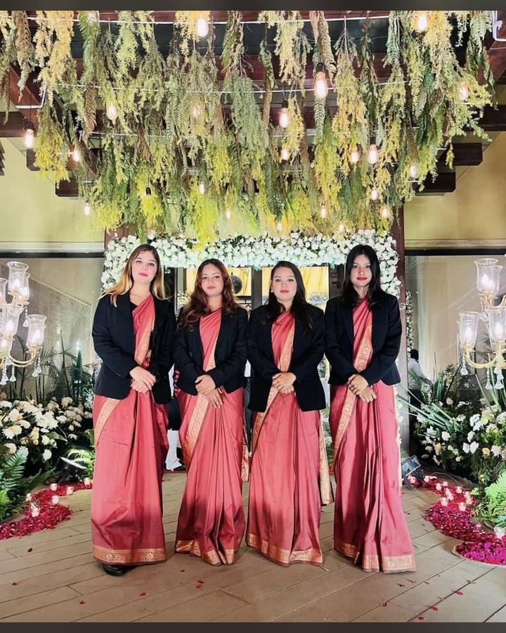 Hostess team at a floral wedding mandap