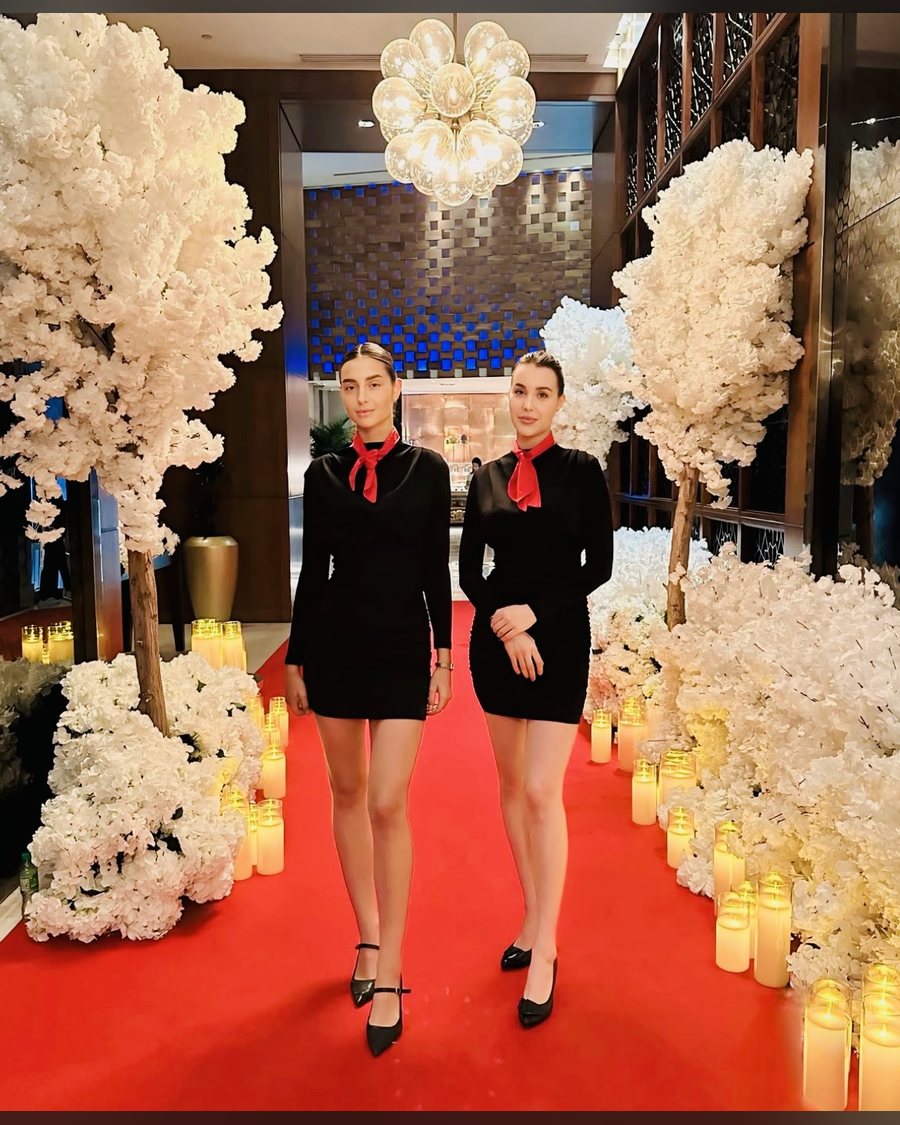 International hostesses on the red carpet entrance at a wedding