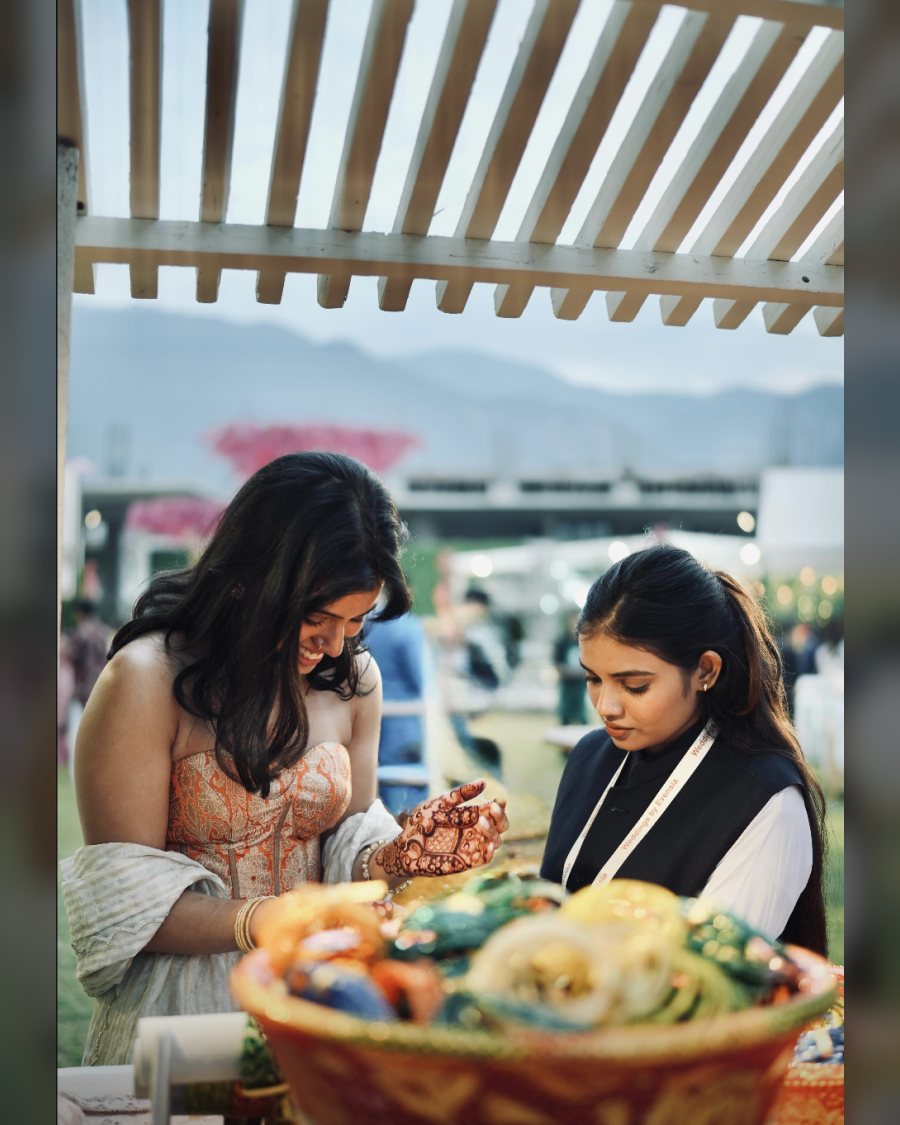 A Shadow attending a guest at a mehendi function