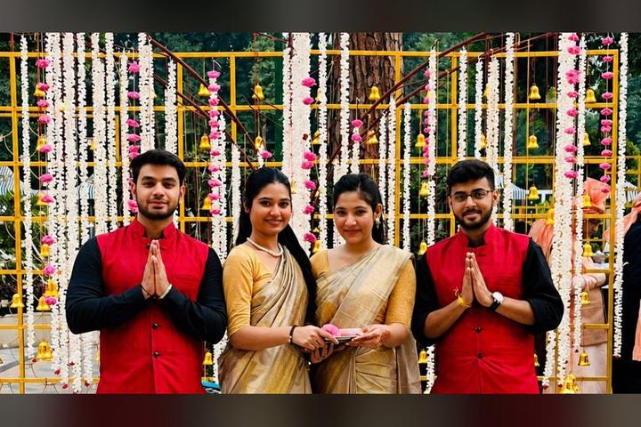 Maangalyam wedding welcome team receiving guests with garlands